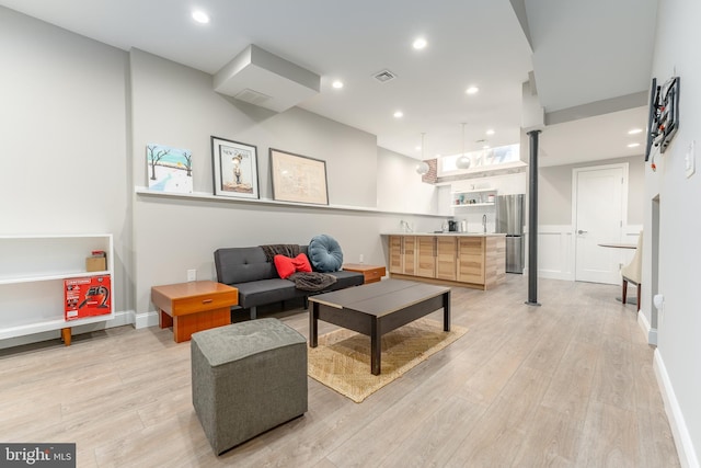 living room with light hardwood / wood-style floors