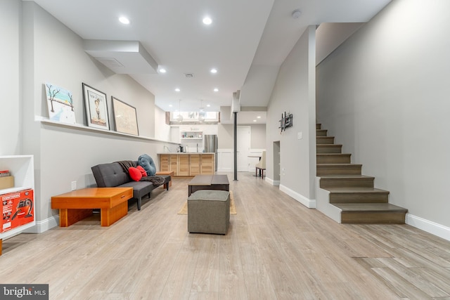 living room with light hardwood / wood-style flooring