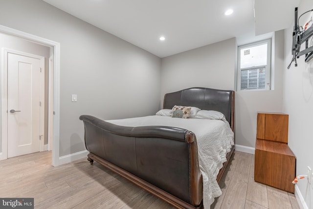 bedroom featuring light hardwood / wood-style floors