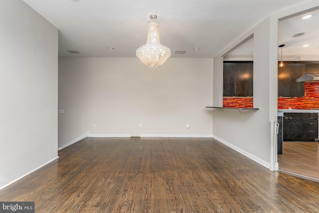 unfurnished living room featuring hardwood / wood-style floors