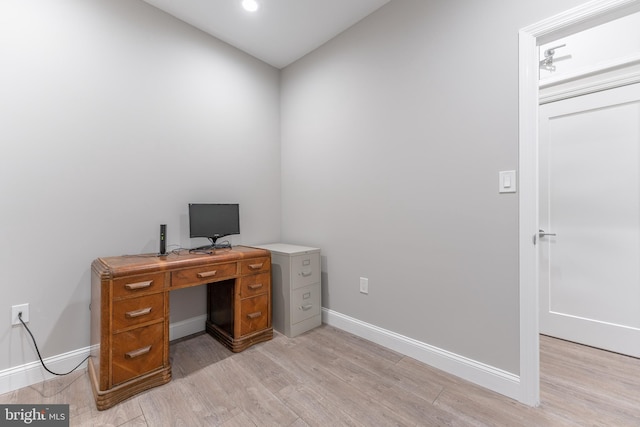 office with light hardwood / wood-style flooring