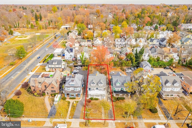 birds eye view of property with a residential view