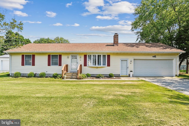 single story home with a garage and a front lawn