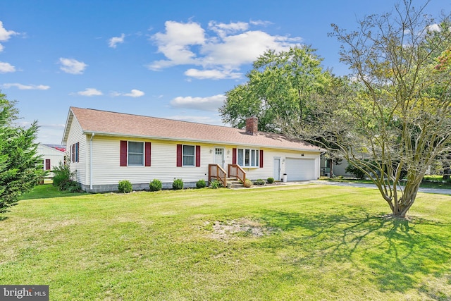 single story home with a garage and a front lawn