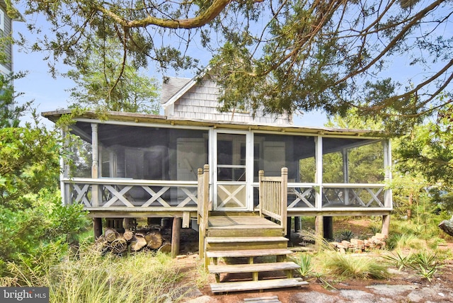 view of front of house with a sunroom