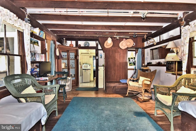 interior space featuring dark hardwood / wood-style floors and beam ceiling