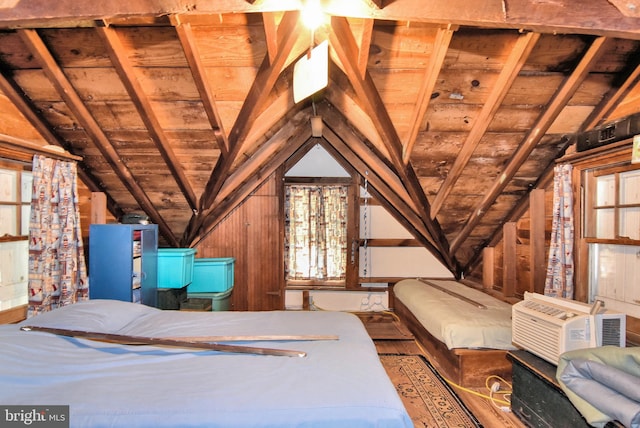 unfurnished bedroom with cooling unit, wood ceiling, wooden walls, and lofted ceiling with beams