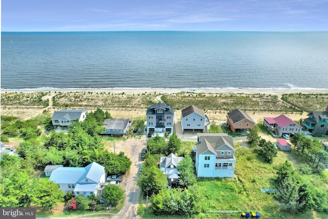 aerial view featuring a view of the beach and a water view