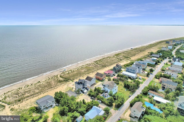 birds eye view of property featuring a water view and a view of the beach