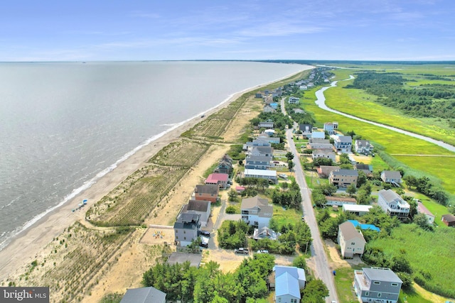 bird's eye view with a view of the beach and a water view