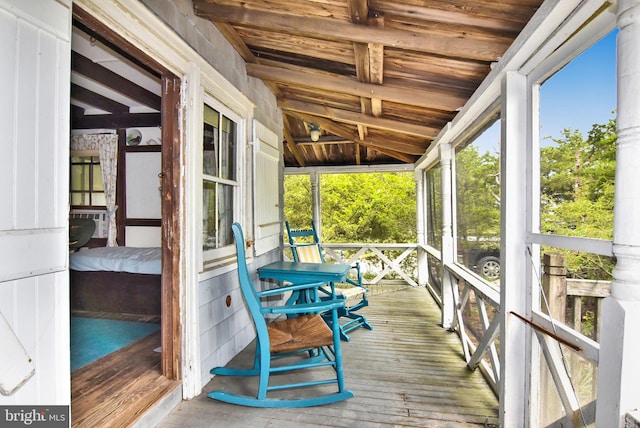 sunroom with vaulted ceiling and wooden ceiling