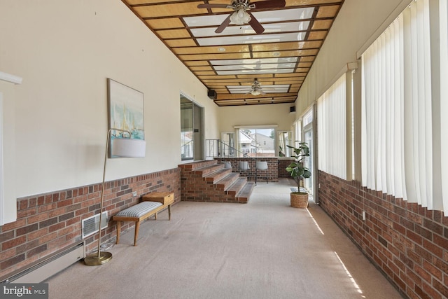 interior space with ceiling fan and baseboard heating