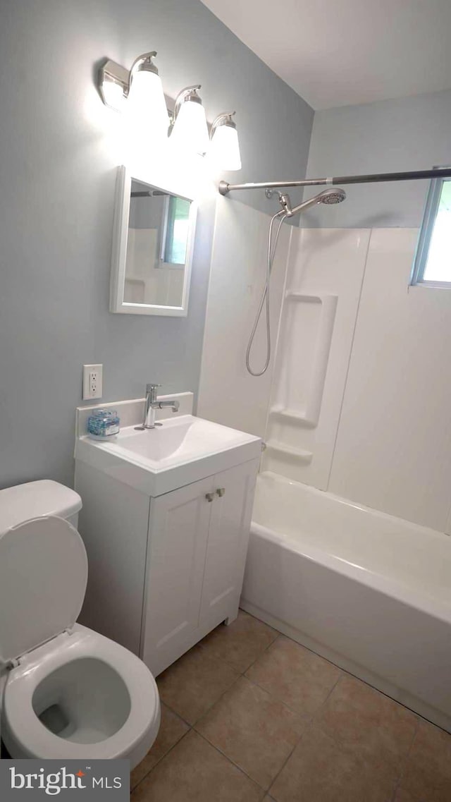 full bathroom with tile patterned flooring, shower / tub combination, vanity, and toilet