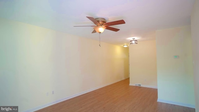 spare room with ceiling fan and light hardwood / wood-style floors