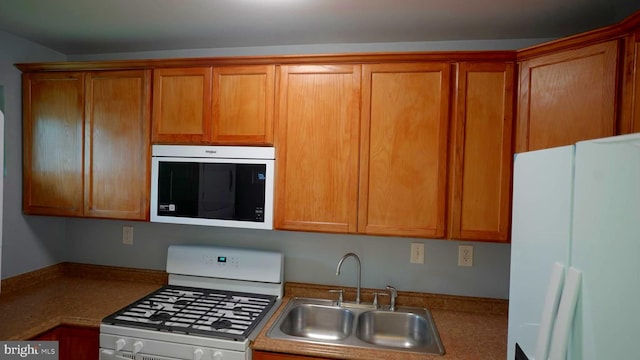 kitchen with sink and white appliances