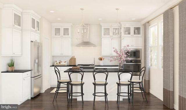 kitchen featuring an inviting chandelier, white cabinetry, high end fridge, oven, and pendant lighting