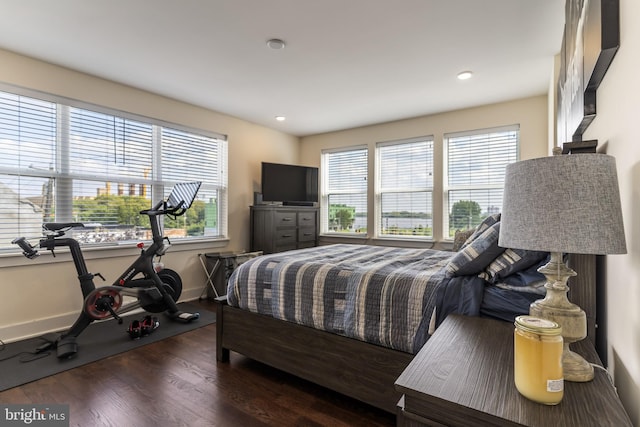 bedroom with dark wood-type flooring