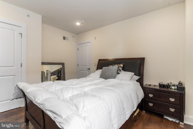 bedroom featuring dark hardwood / wood-style floors