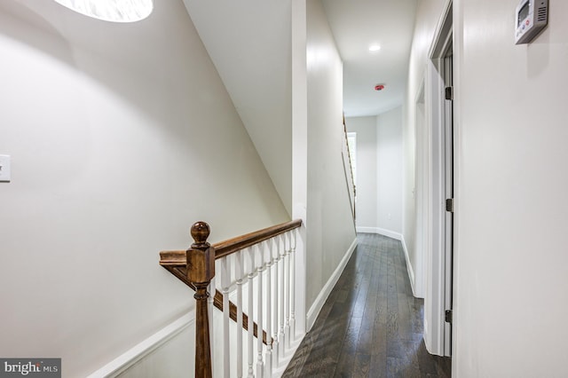 hallway with dark hardwood / wood-style flooring