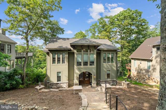 rear view of property with a balcony