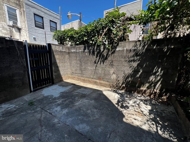 view of gate with fence