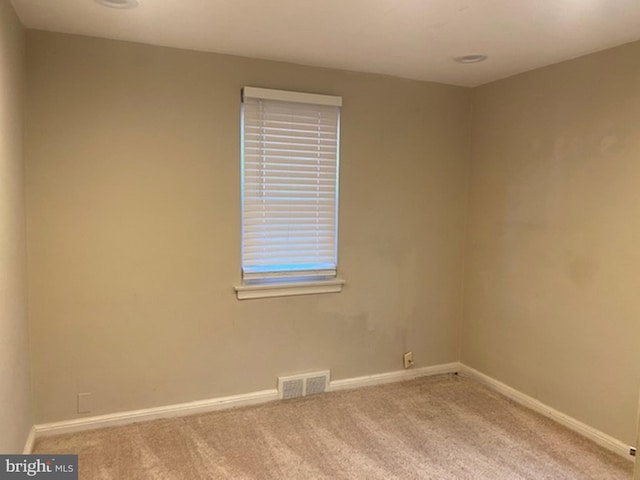 empty room with carpet flooring