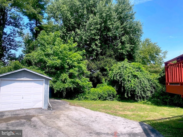 garage featuring a yard