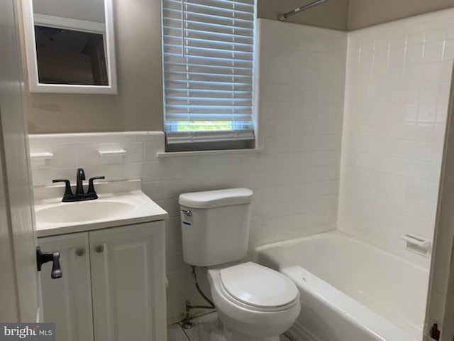 full bathroom with toilet, tile walls, shower / bathtub combination, and vanity