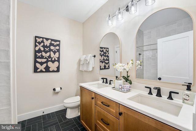 bathroom with toilet and vanity