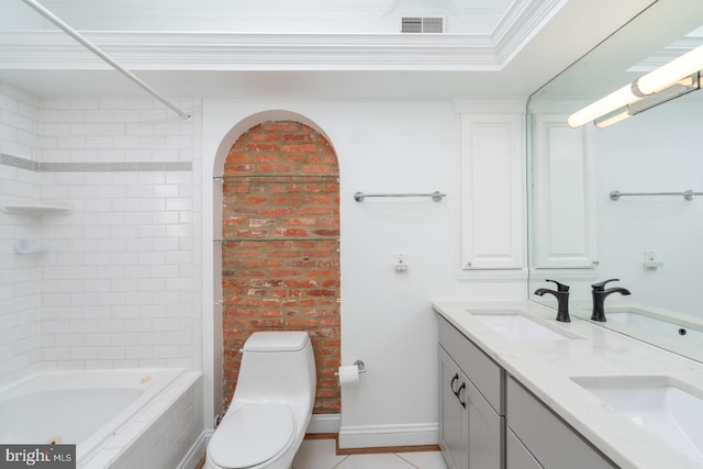 full bathroom with vanity, tile patterned flooring, toilet, ornamental molding, and tiled shower / bath