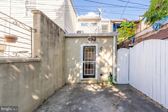 property entrance featuring a patio