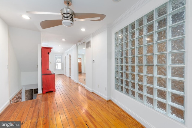 hall featuring crown molding and hardwood / wood-style floors