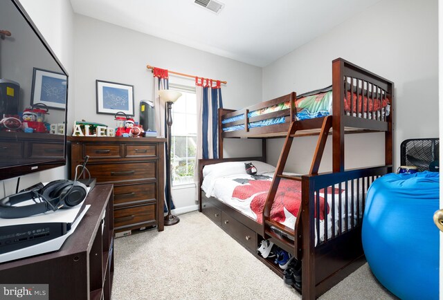 bedroom featuring light colored carpet