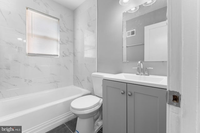 bathroom featuring toilet, vanity, washtub / shower combination, and visible vents