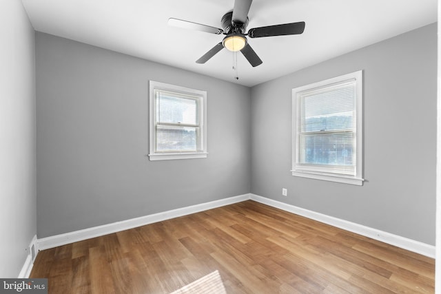 empty room with light hardwood / wood-style flooring and ceiling fan