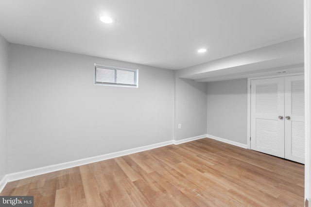 basement featuring light hardwood / wood-style floors