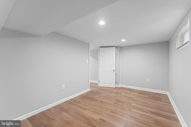 basement featuring light hardwood / wood-style floors