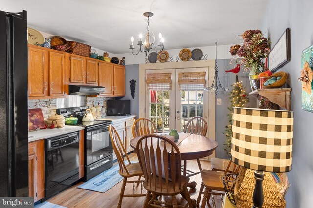 dining room featuring a chandelier and hardwood / wood-style flooring