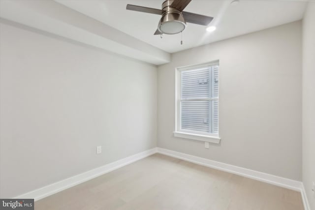 spare room featuring ceiling fan and light wood-type flooring