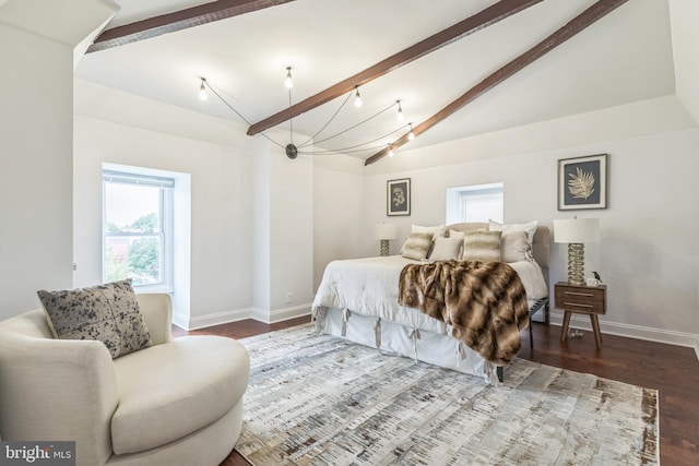 bedroom featuring vaulted ceiling with beams and hardwood / wood-style floors