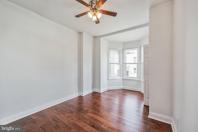 unfurnished room featuring ceiling fan and dark hardwood / wood-style floors