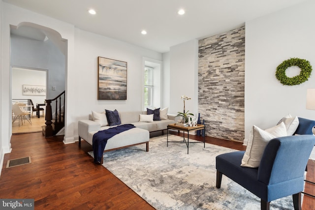 living room featuring dark hardwood / wood-style floors