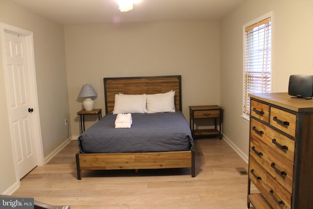 bedroom with light hardwood / wood-style flooring