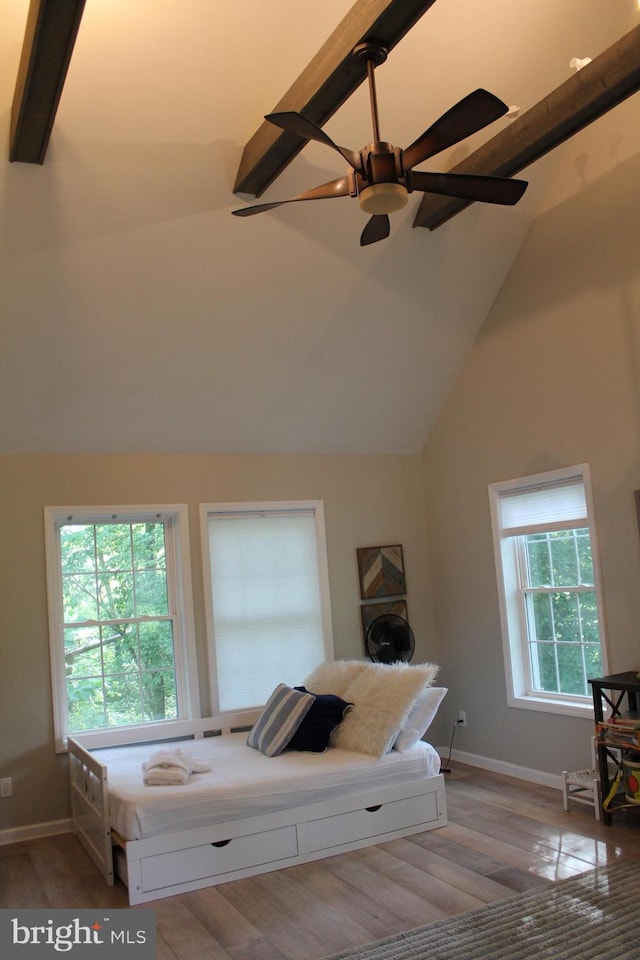 bedroom featuring ceiling fan, high vaulted ceiling, beam ceiling, and light hardwood / wood-style flooring