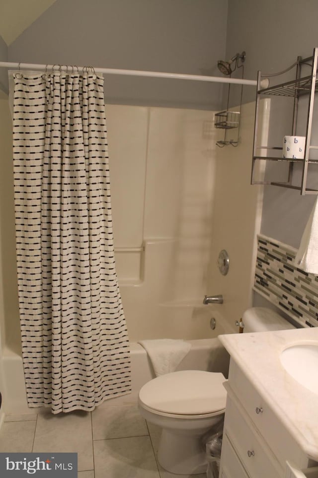 full bathroom with vanity, tasteful backsplash, shower / bathtub combination with curtain, tile patterned floors, and toilet