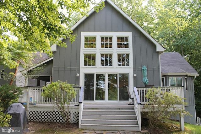 back of property featuring a wooden deck