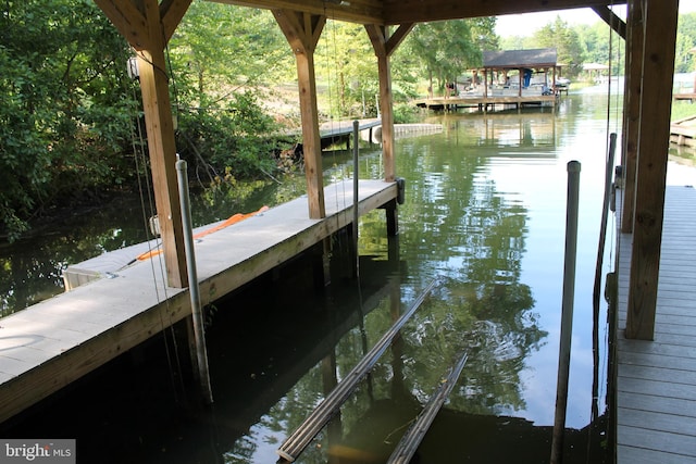 dock area with a water view