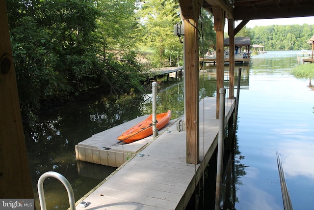 dock area featuring a water view