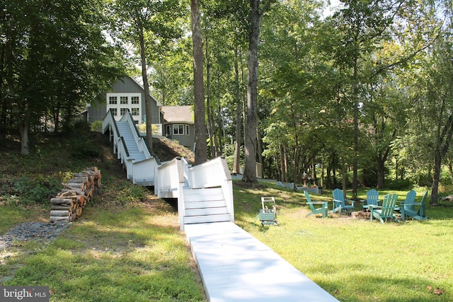 view of yard with an outdoor fire pit