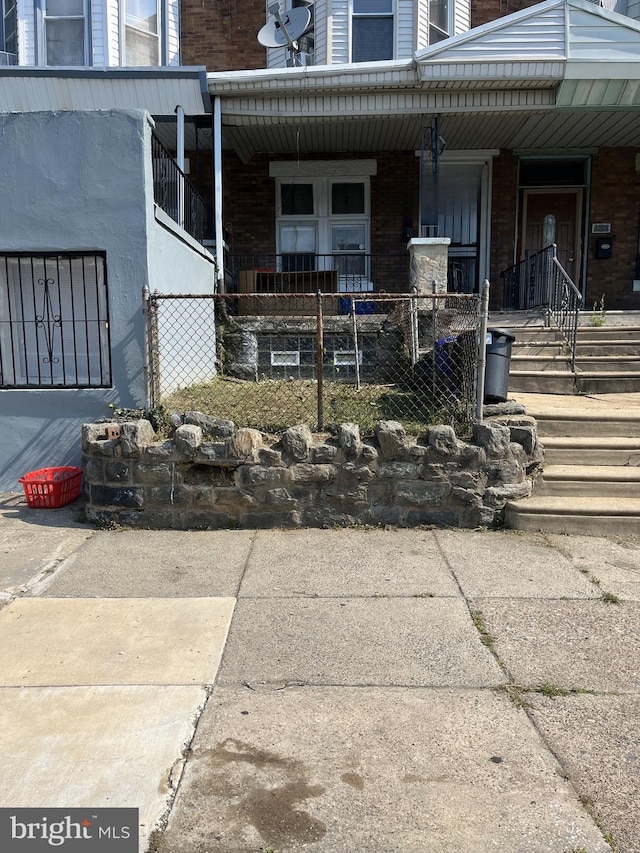 view of exterior entry with covered porch